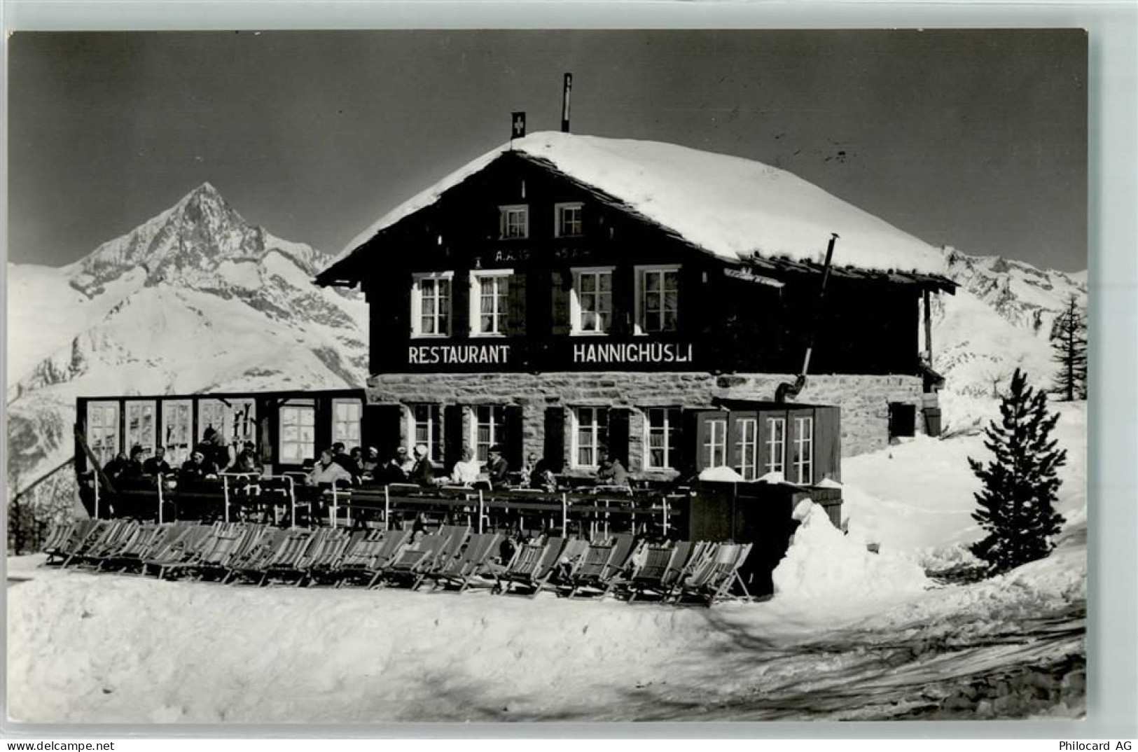 3925 Grächen Foto AK Gasthaus Hannighusli Winter Schnee Liegestuhl Hanni... - 10586358