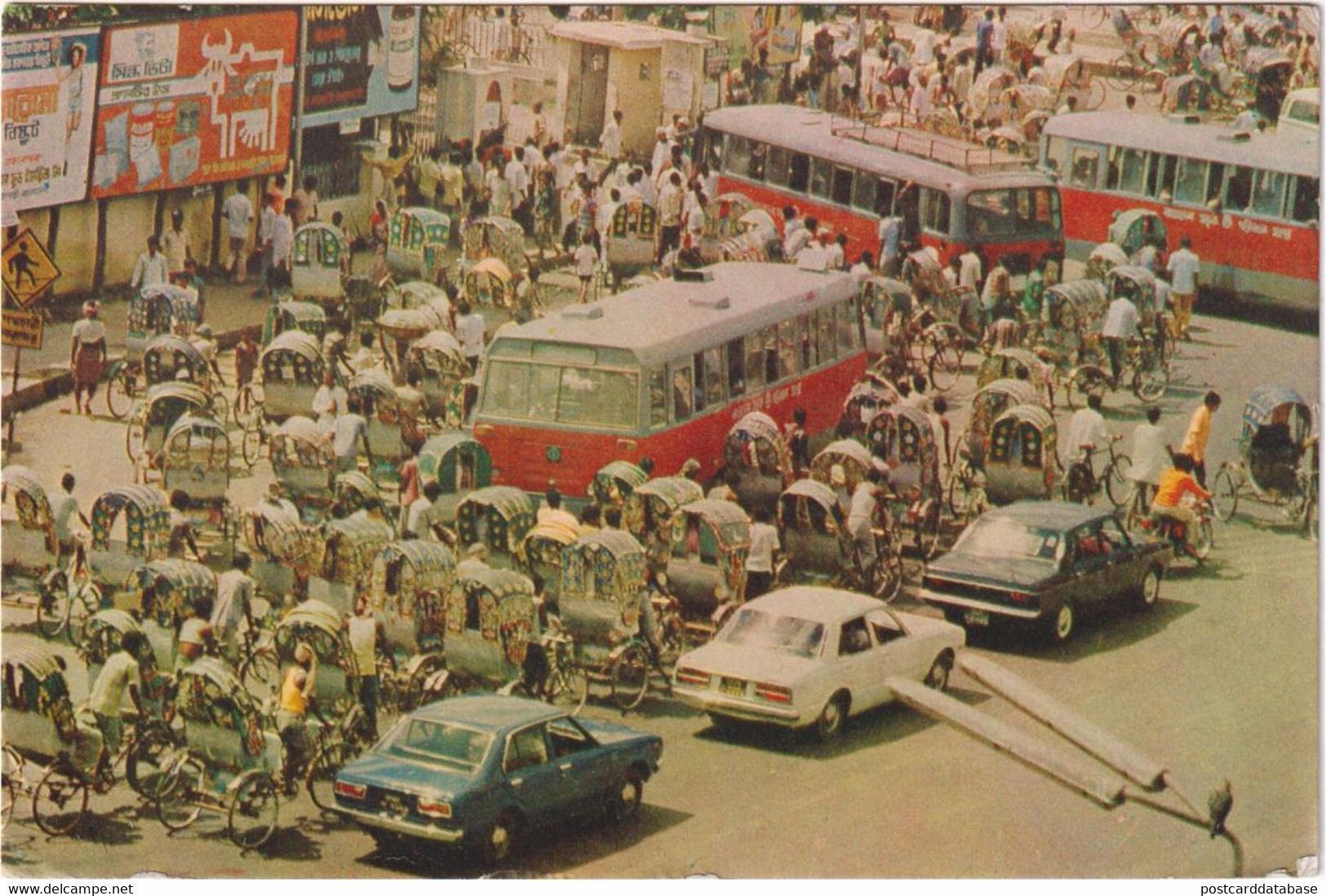 A busy street, Dacca - & old cars, bus, bicycle
