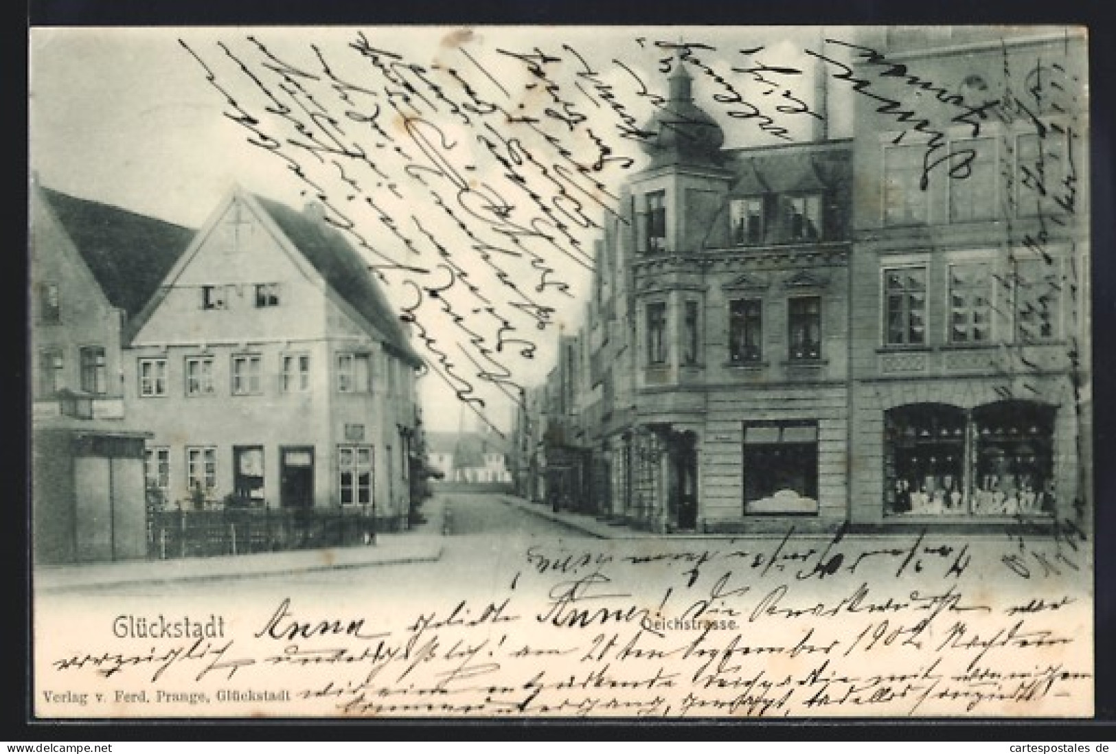 AK Glückstadt, Deichstrasse mit Geschäften