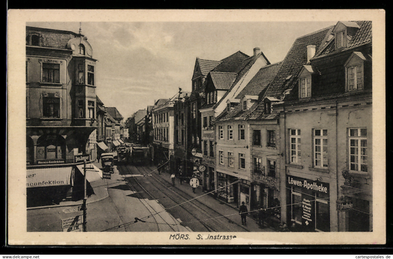 AK Mörs, Steinstrasse mit Löwen-Apotheke, Strassenbahn