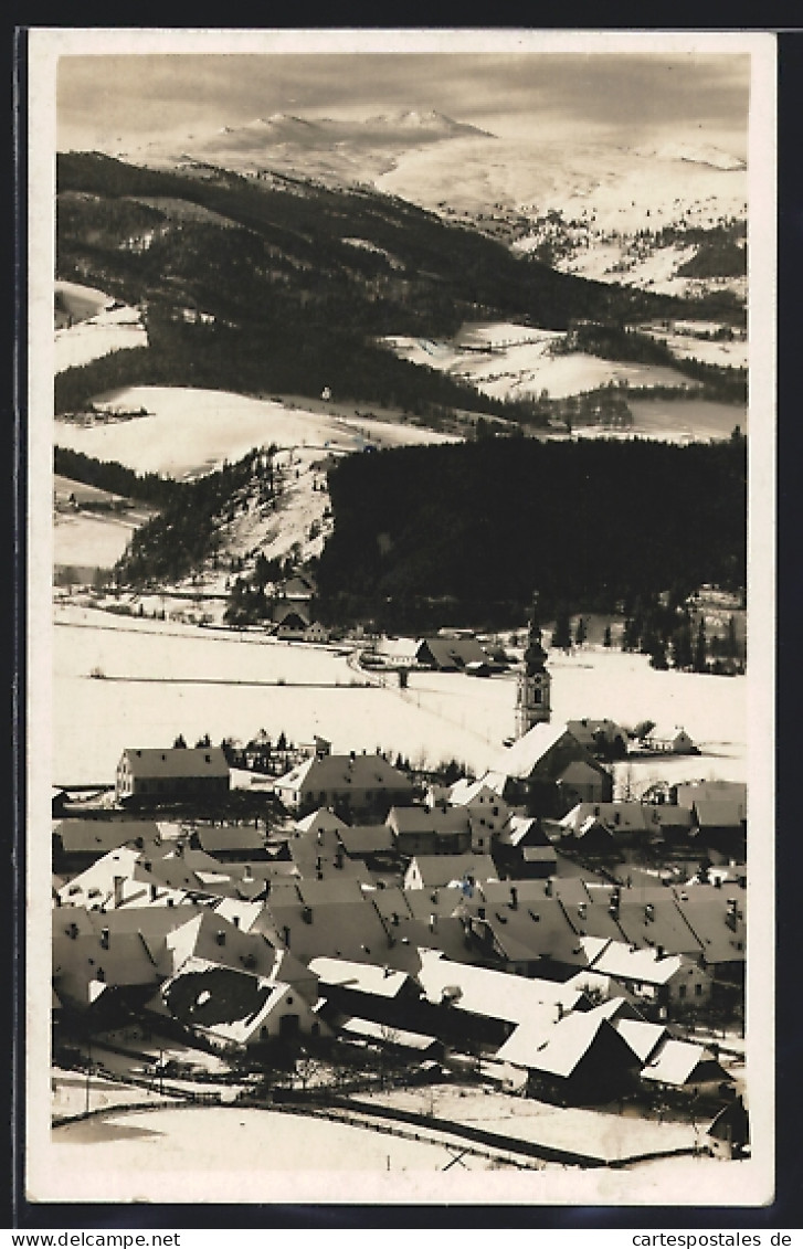 AK Obdach, Ortsansicht mit Bergen im Winter