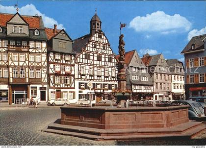 Butzbach Marktplatz mit ehem Gasthof Goldener Loewe und Rathaus Brunnen