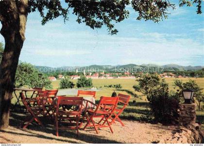 Neutrauchburg Isny Allgaeu Bayern Blick-auf-Isny Terrasse Tische Stuehle Wiesen