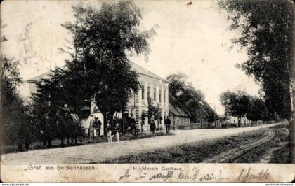 CPA Seckenhausen Stuhr in Niedersachsen, H. Meyers Gasthaus, Straßenansicht, Hund