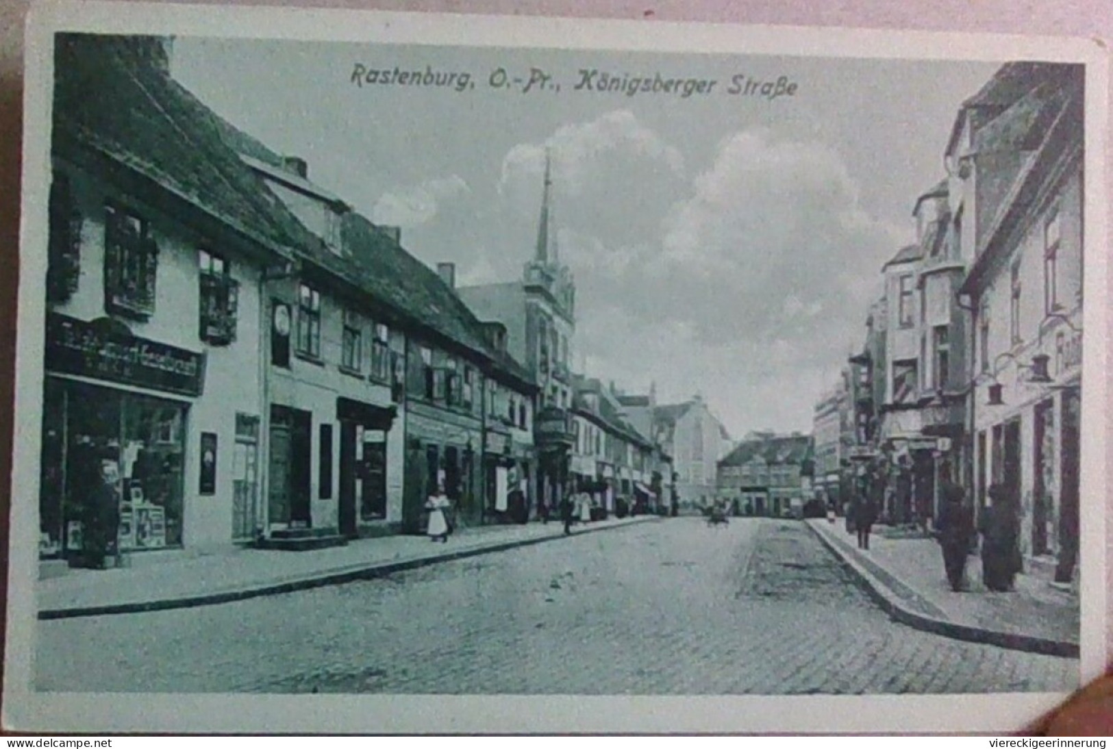 ! alte Ansichtskarte Rastenburg in Ostpreußen, Königsberger Straße, Geschäfte, Läden