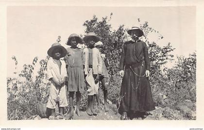 DOMINICA - Father Alphonse and 4 native children on the road to Mahaut - REAL PHOTO