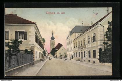 AK Sierning /Ob.-Oest., Strasse mit Gewerbe Franz Wintermayr und Kirche