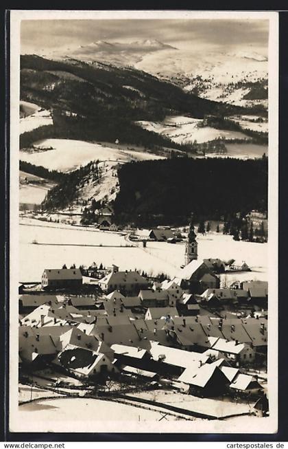 AK Obdach, Ortsansicht mit Bergen im Winter