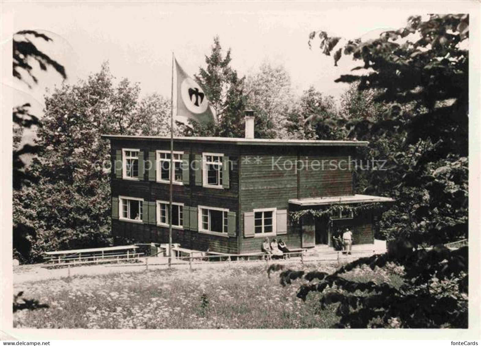 Buchenegg Stallikon ZH Kinderfreundeheim Moesli Holzhaus Fahne Baeume Wald Terra