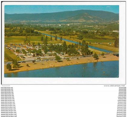carte de SKAHA  BEACH AND OKANAGAN WITH THE CITY  ( cachet penticton ) ( recto verso )