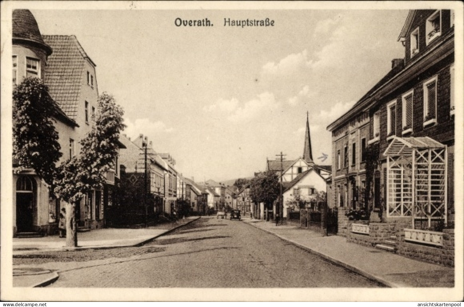 CPA Overath NRW, Partie in der Hauptstraße, Kirchturm, Wohngebäude