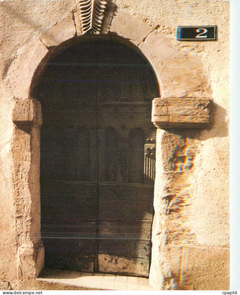 CPM Saint-Pons de Thomieres Porte romane dans la ville ancienne
