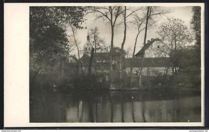 Foto-AK Zörbig, Kirche und Häuser am Wasser