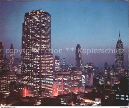 New York City Night falls on Midtown Manhattan RCA Building Chrysler Building Em