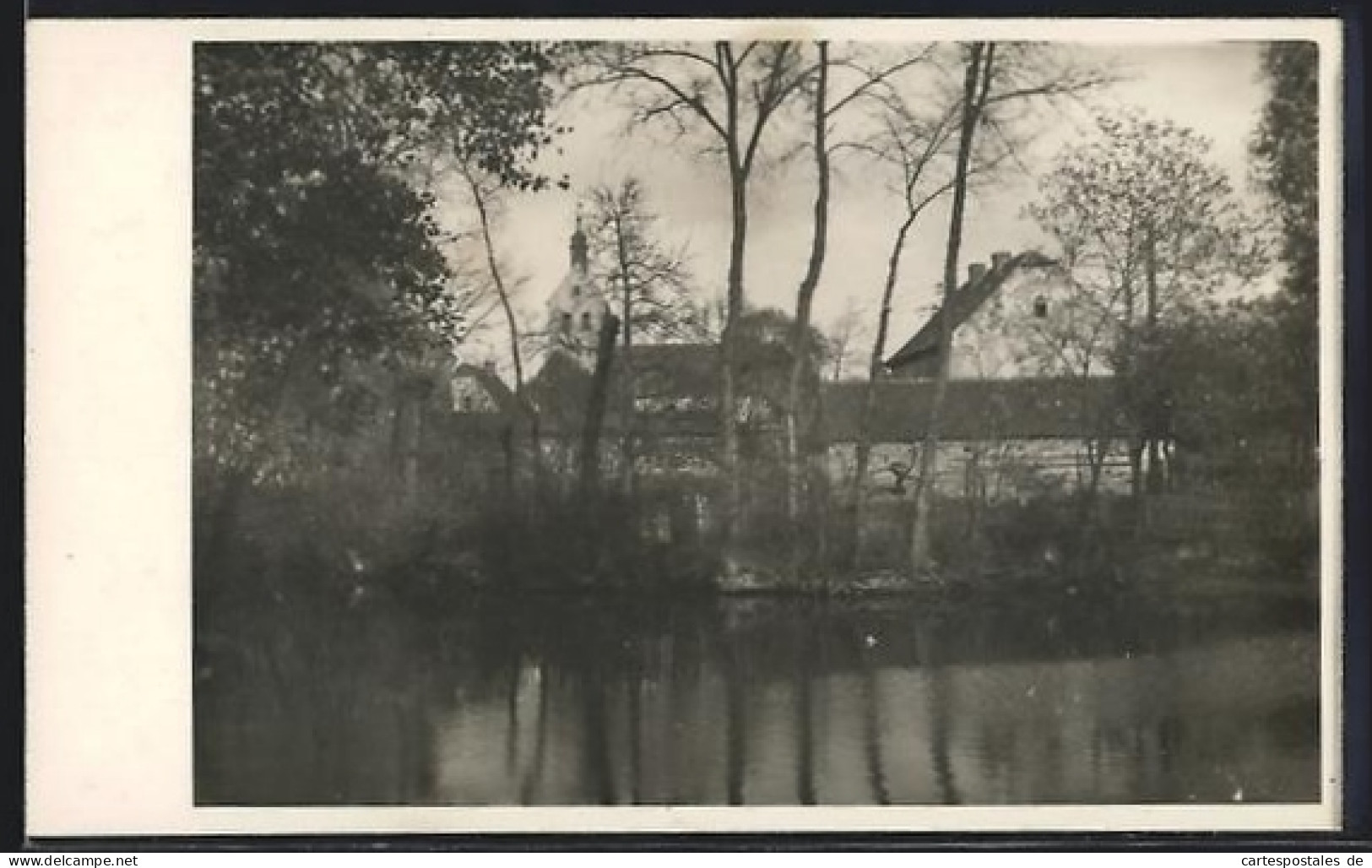 Foto-AK Zörbig, Kirche und Häuser am Wasser