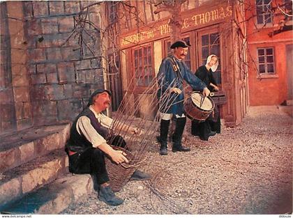 Carte Postale - 80 - Les Grottes de Naours - Le vannier  le Garde champetre et la Tireloteuse - Métiers d'antan - Flamme