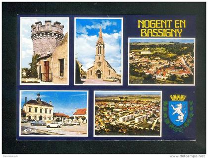 CPSM - Nogent en Bassigny ( Haute Marne 52) - Multivues ( vue aérienne église automobile blason COMBIER CIM )