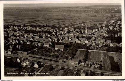 CPA Bernhausen Filderstadt Bade Württemberg, Luftaufnahme von Häuser, Felder, Kirche, 1930er Jah