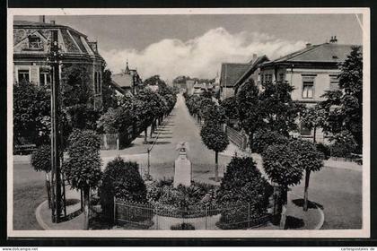 AK Ortrand, Bahnhofstrasse mit Kriegerdenkmal 1870-71