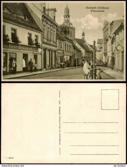 Ansichtskarte Hettstedt (Südharz) Wilhelmstraße, Geschäfte 1914