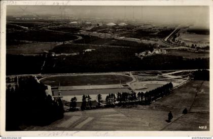 CPA Lautawerk Lauta in der Lausitz, Luftbild Stadion, Straßen und Fabriken im Hintergrund