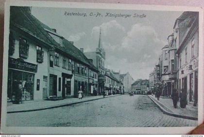 ! alte Ansichtskarte Rastenburg in Ostpreußen, Königsberger Straße, Geschäfte, Läden