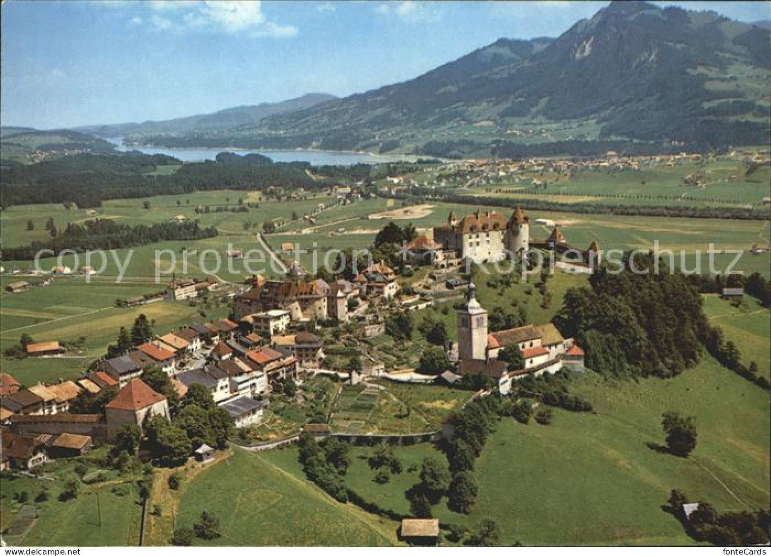 Gruyeres FR Au fond Broc et lac de la Gruyere