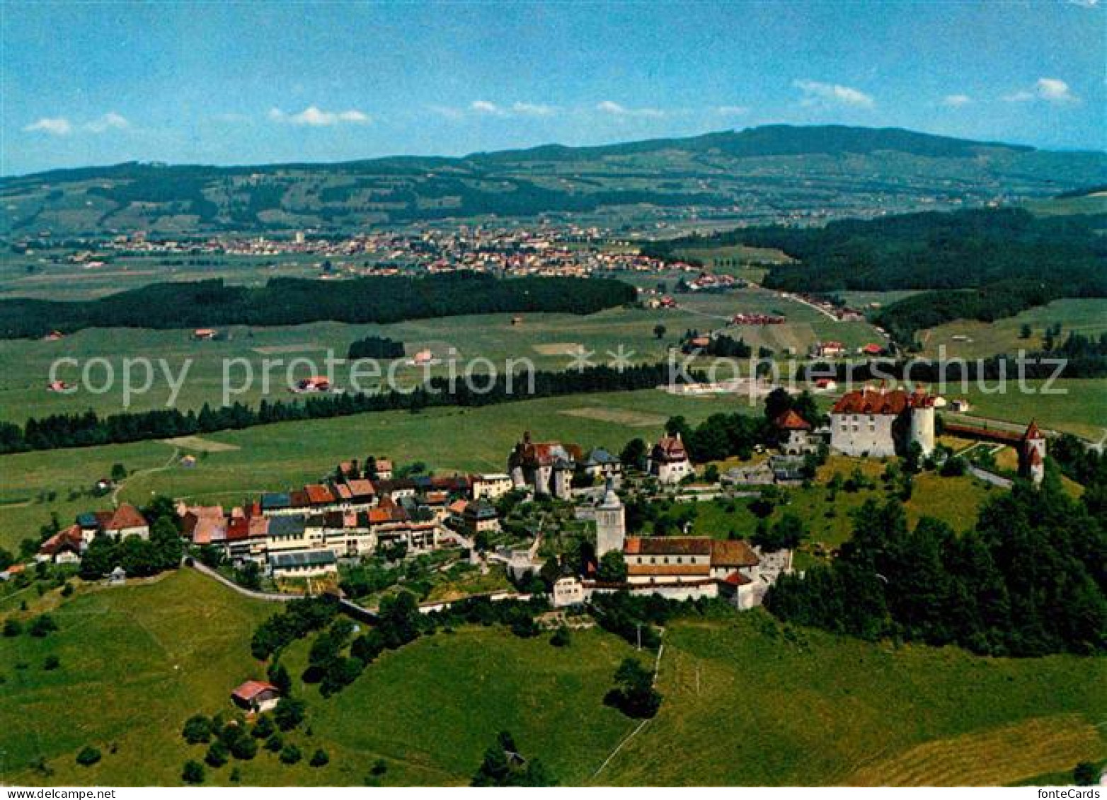 Gruyeres FR Au fond Bulle et La Tour de Treme