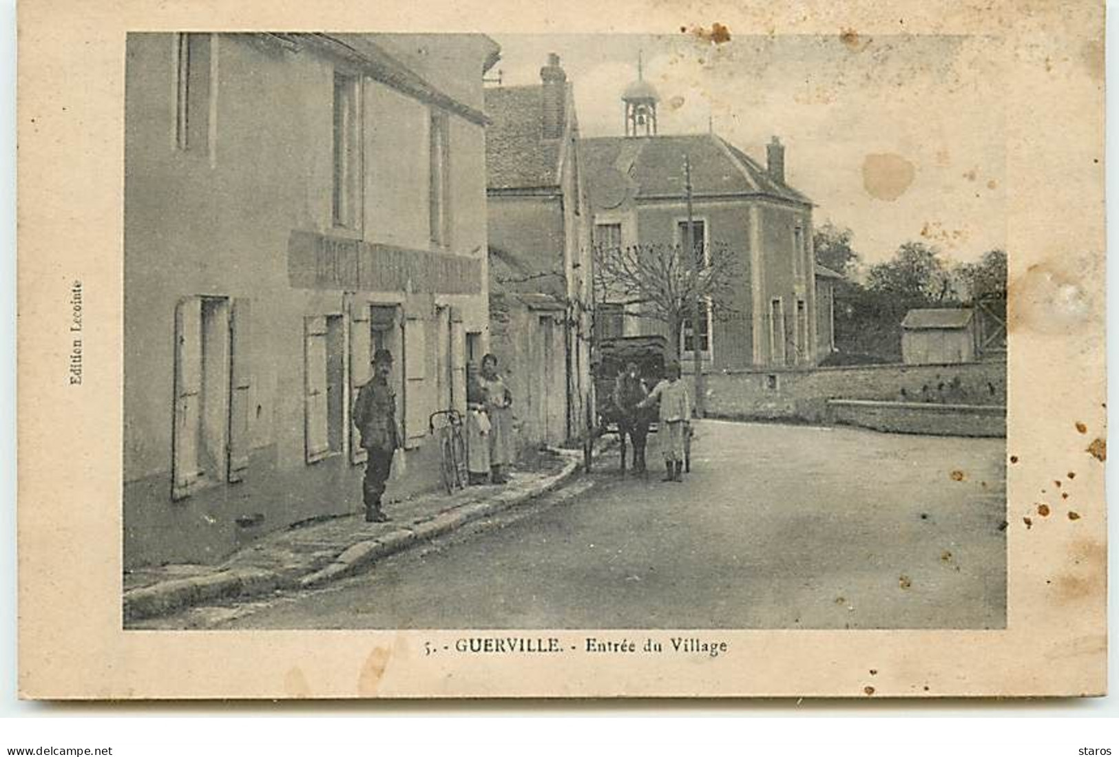 GUERVILLE - Entrée du Village - Carte vendue en l'état