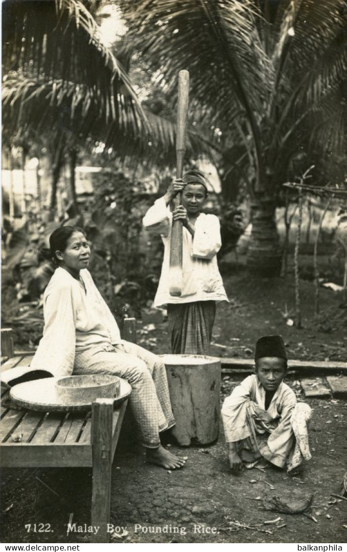 Malaysia Malay Boy Pounding Rice
