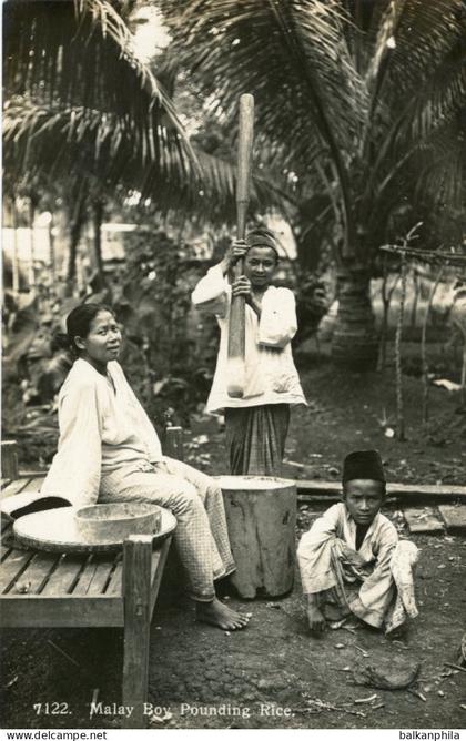 Malaysia Malay Boy Pounding Rice