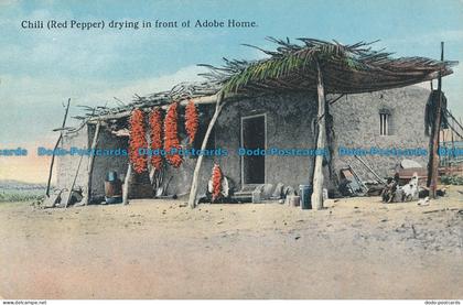 R036336 Chili Drying in Front of Adobe Home