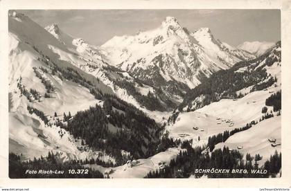AUTRICHE - Schröcken - Montagne - Neige - Forêt - conifères - Habitations - Foto Risch Lau  - Carte postale