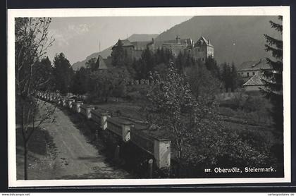AK Oberwölz, Strassenpartie mit Burgblick