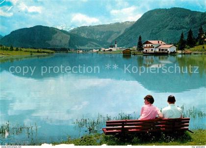 St Ulrich Pillersee Uferpartie Ruhebank am See nahe Strandbad Blattl Alpenblick