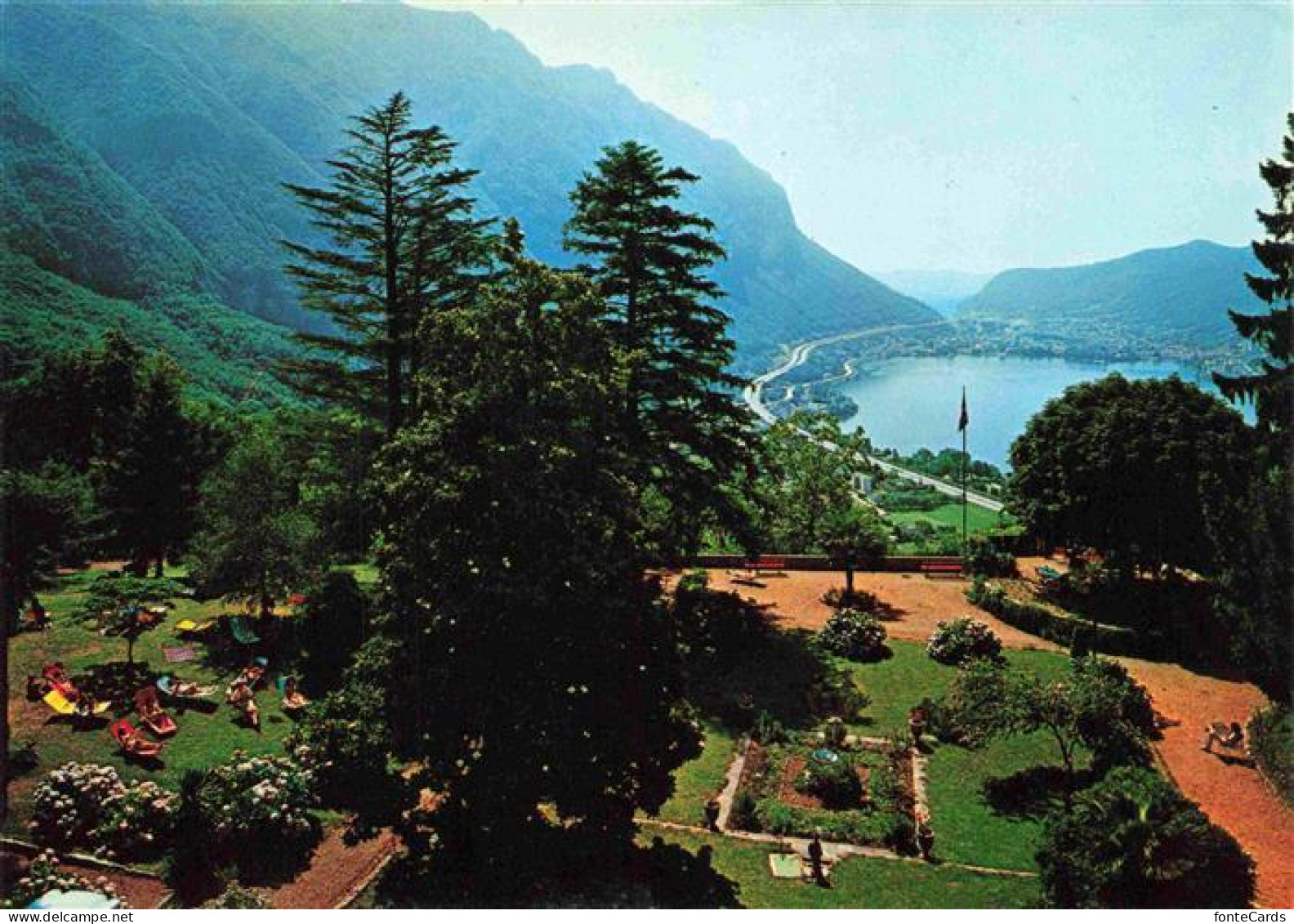 Rovio Lugano TI Park-Hotel Garten Lago-di-Lugano Berge Liegewiese Baeume Terrass