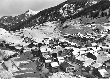 [-5%] SUISSE - Nax - Vue panoramique - Neige - Village - Forêt - sapin - montagne - toiture - maison - Carte postale