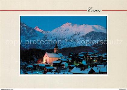 Ernen Ortsansicht mit Kirche Blick zum Finsteraarhorn Berner Alpen Nachtaufnahme