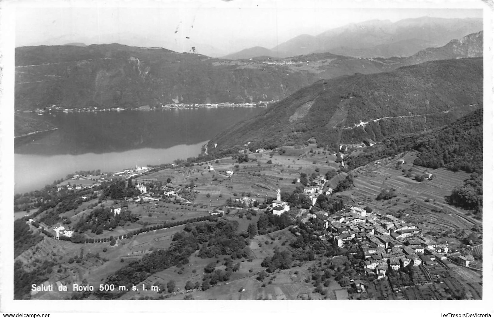 SUISSE - Rovio - Vue aérienne - Village - Eglise - Lac d Orta - Montagnes - Végétation - Paysage - Carte postale