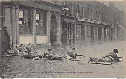 England - London - The East End Siege - Siege of Sidney Street - January 1911 - Guards lying prone on ground firing at a