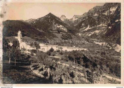 Rovio Lugano TI Bergdorf Kirche Bergpanorama Tal Weinberge Baeume Rueedi